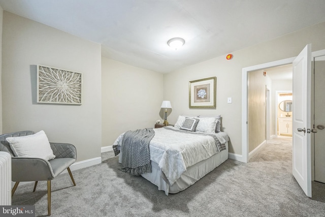 bedroom featuring light colored carpet