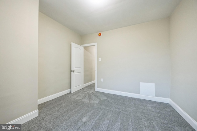 spare room featuring carpet flooring