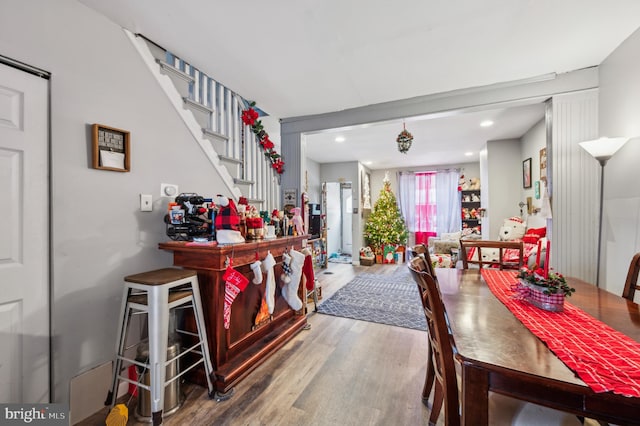 dining space with hardwood / wood-style floors