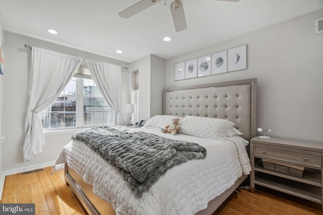 bedroom featuring ceiling fan and hardwood / wood-style flooring