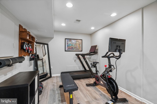 exercise area featuring wood-type flooring