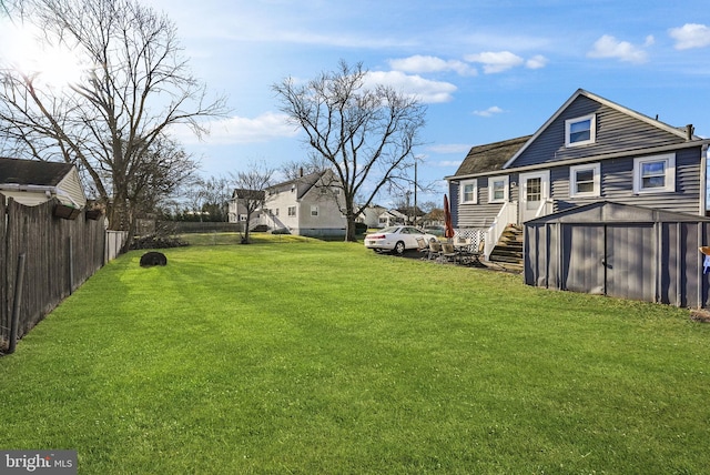 view of yard with a storage shed