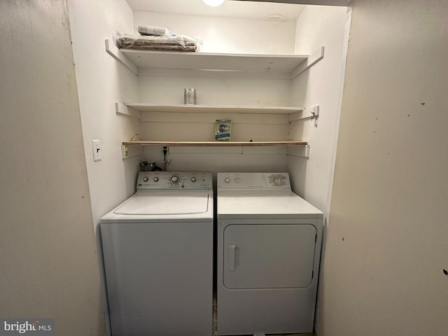 clothes washing area with independent washer and dryer