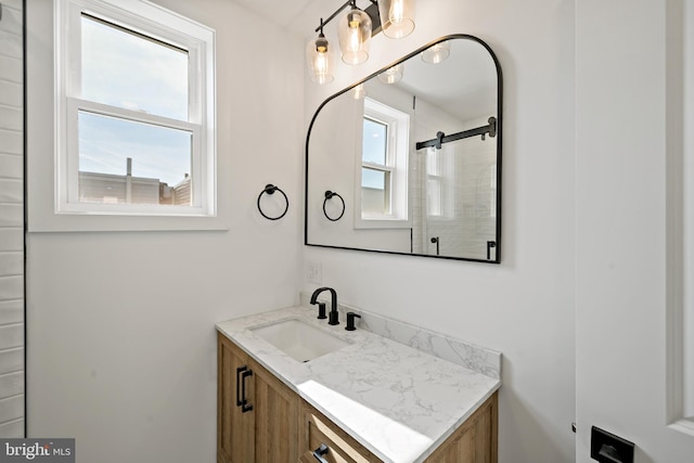 bathroom featuring vanity and plenty of natural light