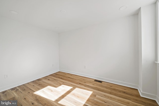 spare room with light wood-type flooring