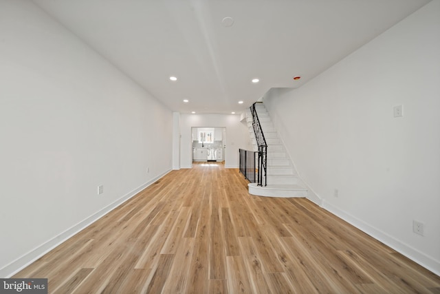 unfurnished living room with light hardwood / wood-style flooring