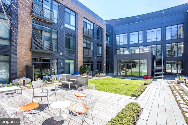 exterior space featuring a lawn and an outdoor living space