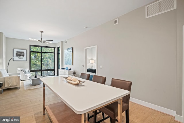 dining area featuring ceiling fan and light hardwood / wood-style floors