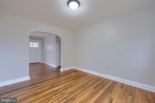 empty room featuring wood-type flooring