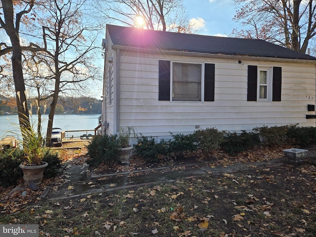 view of side of home featuring a water view