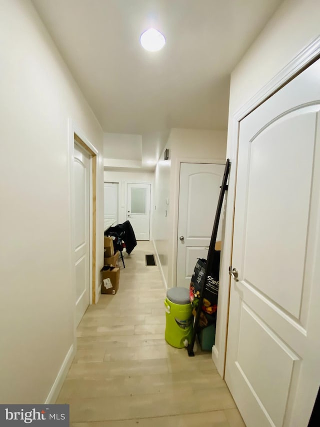 hall with light wood-type flooring