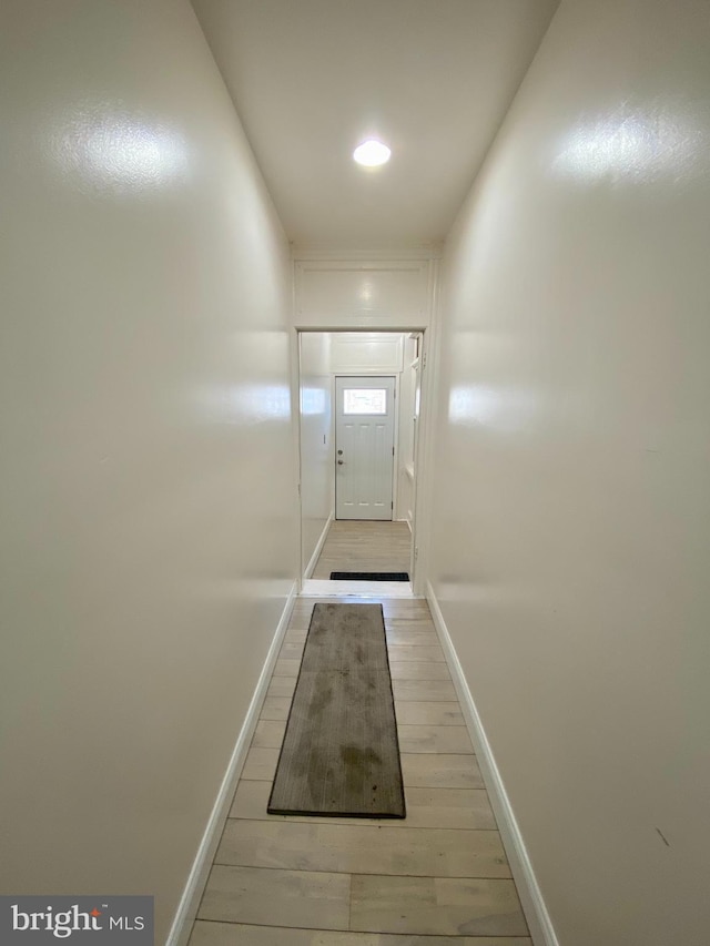 doorway with light wood-type flooring