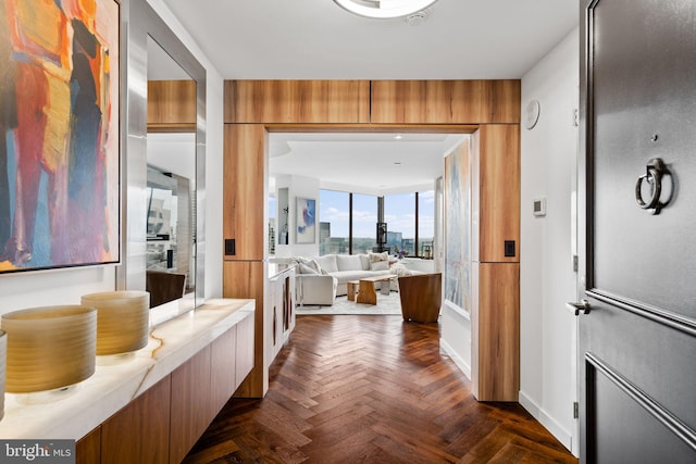 bathroom with a washtub, vanity, and parquet floors