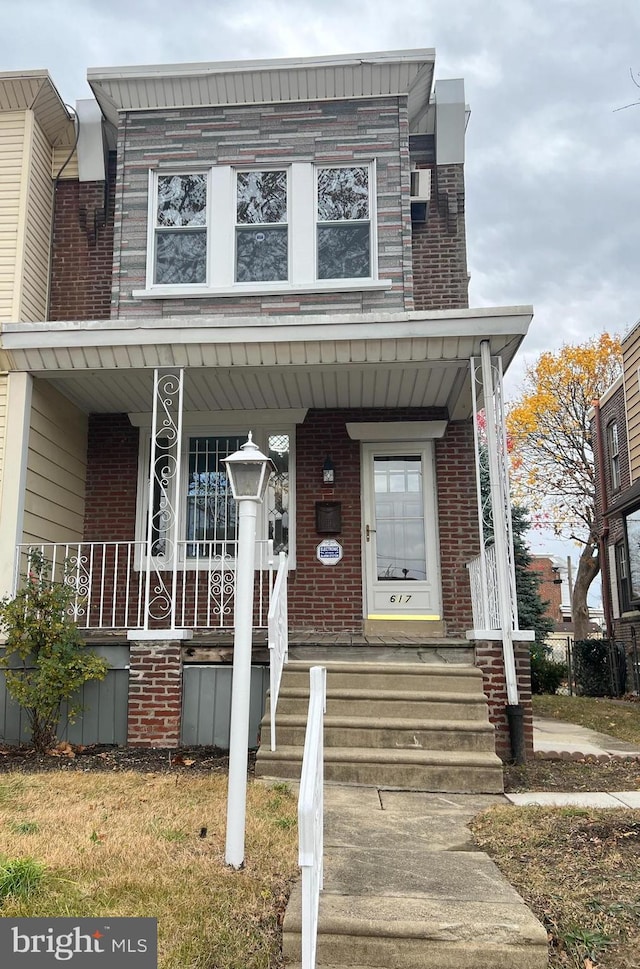 multi unit property featuring a porch