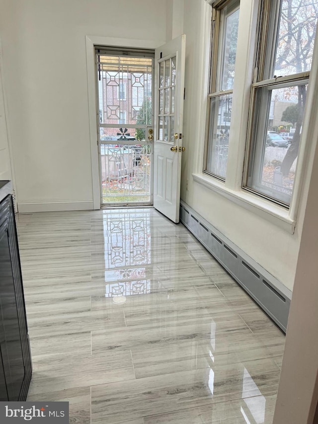 entryway with a baseboard heating unit