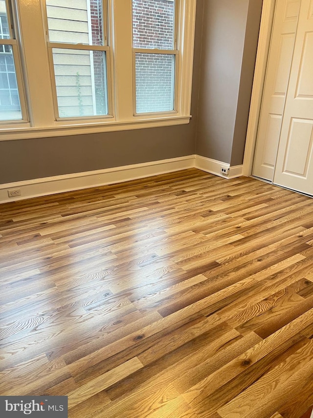 unfurnished bedroom featuring light wood-type flooring