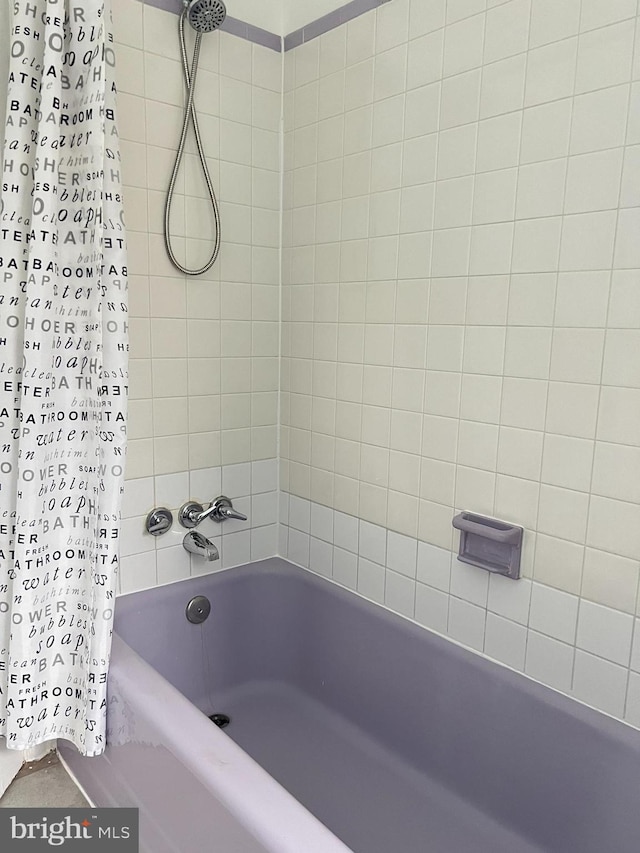 bathroom featuring shower / bath combination with curtain