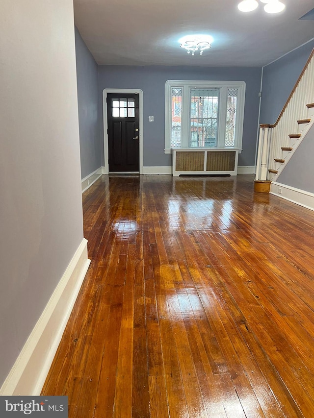 foyer featuring dark hardwood / wood-style floors