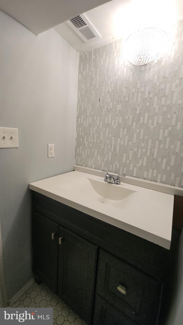 bathroom featuring visible vents and vanity