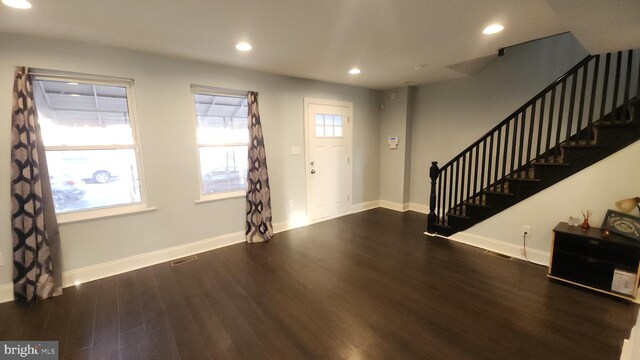 foyer entrance with dark wood-style floors, recessed lighting, baseboards, and stairs