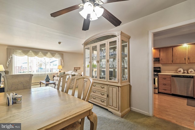 dining space featuring light hardwood / wood-style floors and ceiling fan