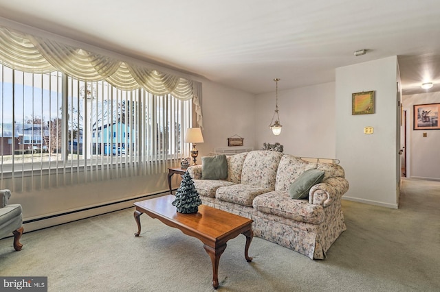 living room with carpet and a baseboard heating unit