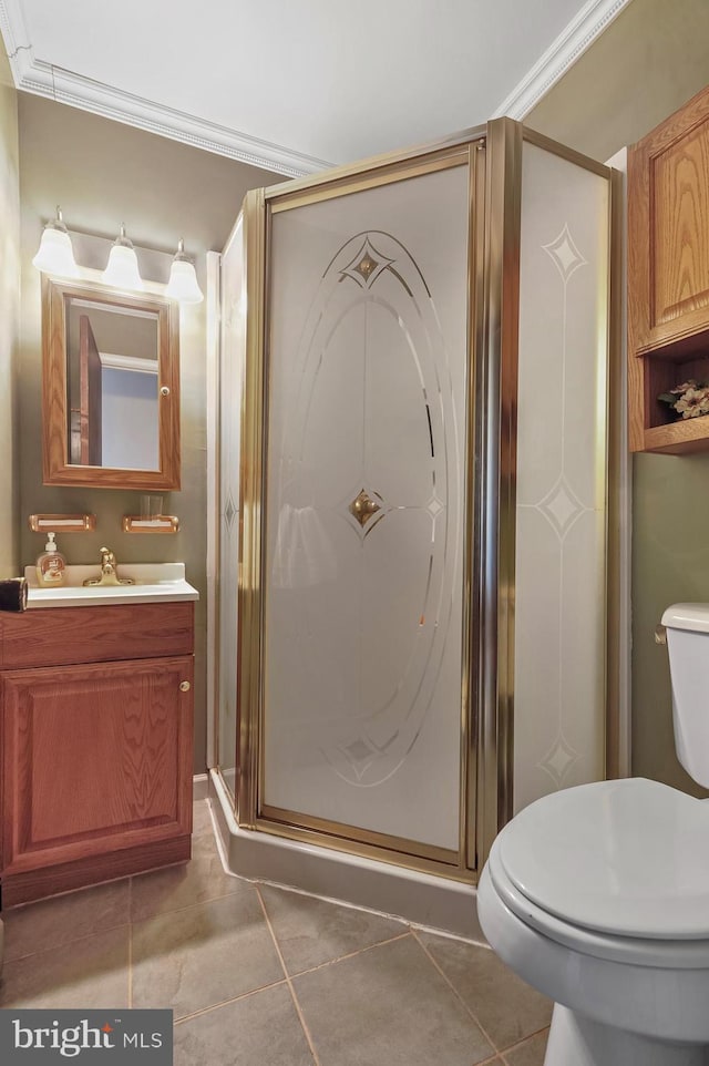 bathroom featuring walk in shower, crown molding, tile patterned flooring, and toilet