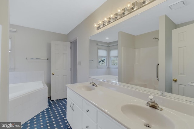 bathroom with separate shower and tub and vanity