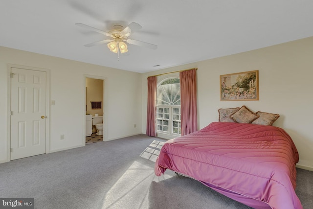 bedroom featuring carpet flooring, ceiling fan, and ensuite bath