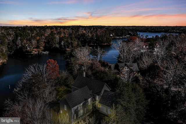 aerial view at dusk with a water view