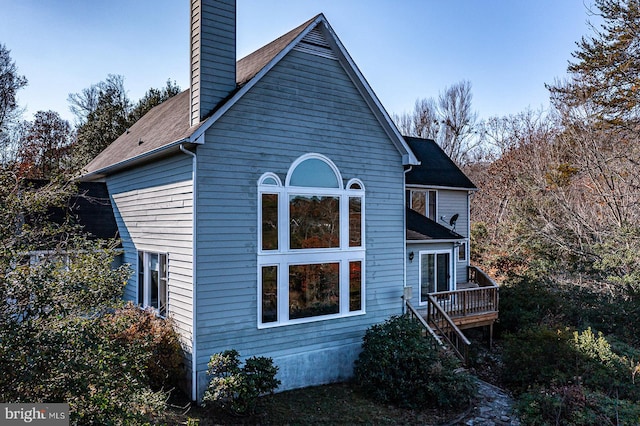 view of home's exterior with a deck