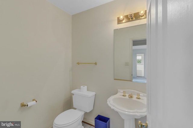 bathroom with toilet and sink