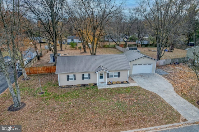 ranch-style home with a garage and a front lawn