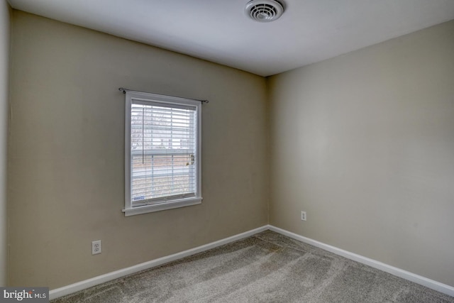 view of carpeted spare room