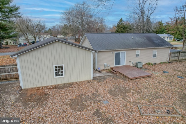 back of property featuring central air condition unit