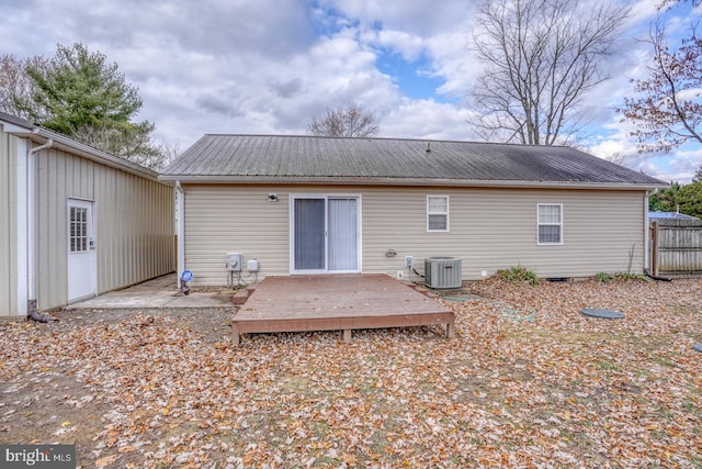 back of house with a wooden deck and central AC unit