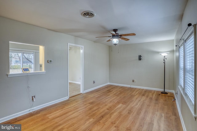 spare room with ceiling fan and light hardwood / wood-style floors