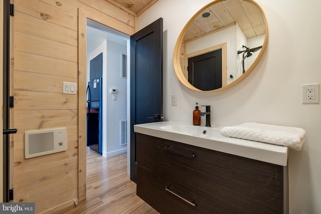 bathroom featuring vanity and wood-type flooring