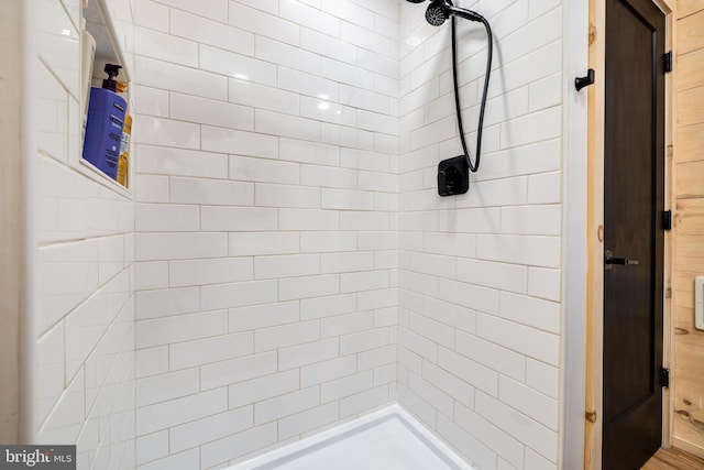 bathroom with tiled shower