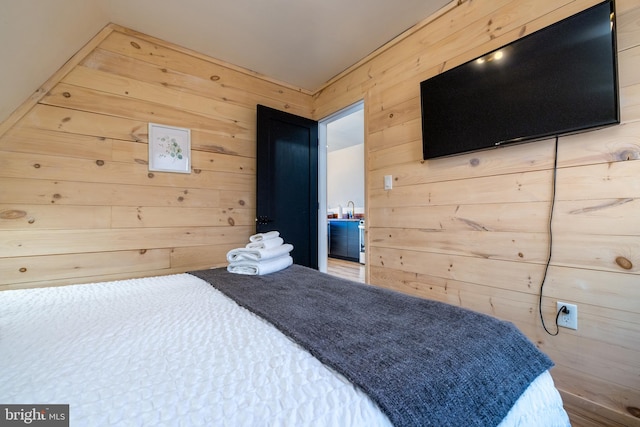 bedroom with wooden walls