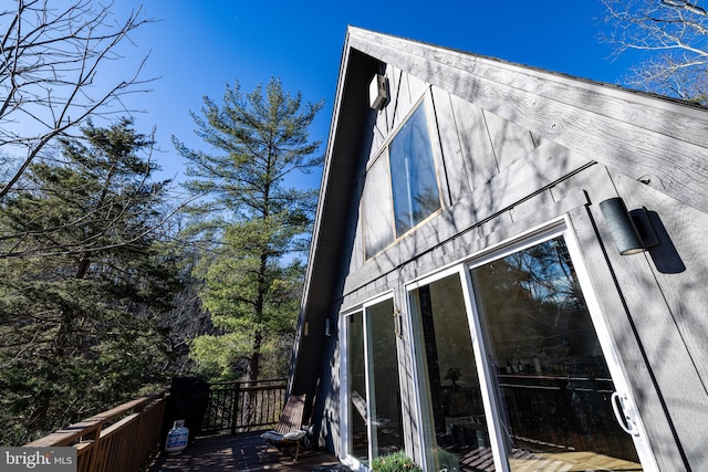 view of side of home with a deck