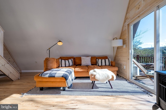 interior space featuring light hardwood / wood-style flooring and wood walls