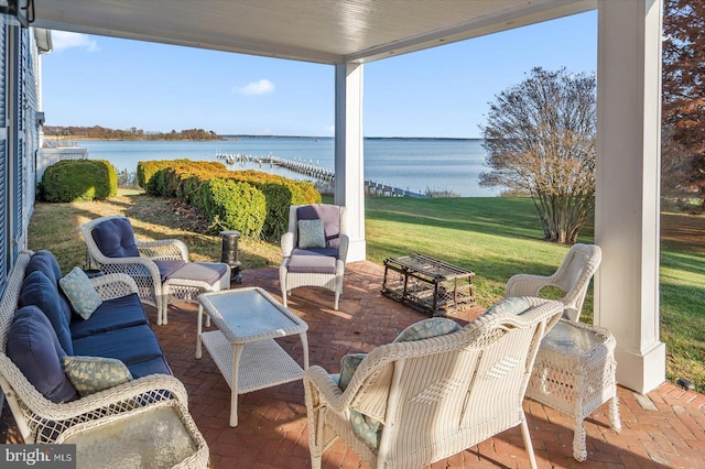 view of patio / terrace with a water view and outdoor lounge area