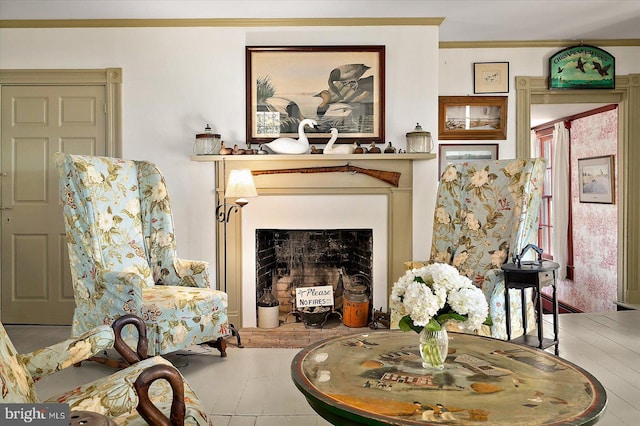 living area featuring ornamental molding and wood-type flooring