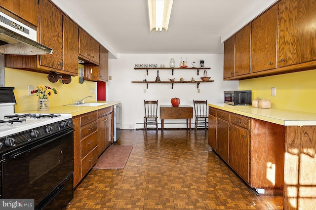 kitchen with dark parquet flooring, dishwasher, a baseboard heating unit, sink, and gas range oven