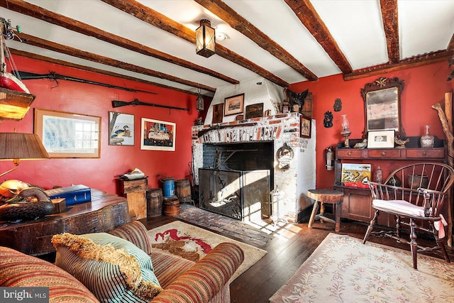 living room featuring beam ceiling and wood-type flooring