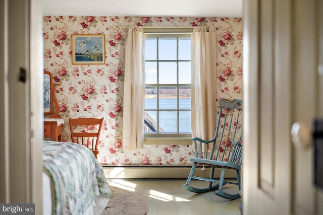 tiled bedroom featuring a baseboard heating unit