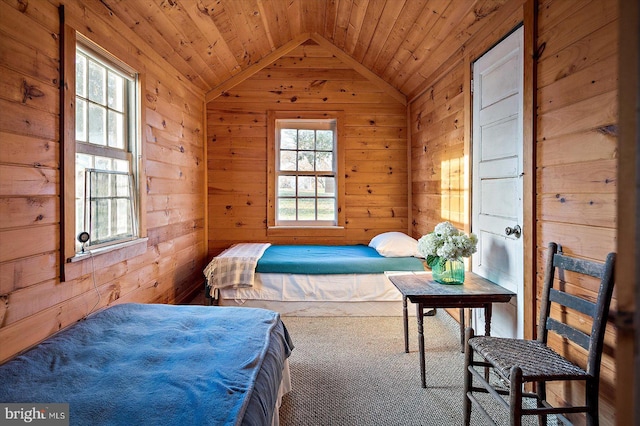 carpeted bedroom with wood walls, lofted ceiling, and wood ceiling