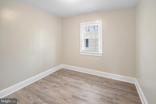 unfurnished room with light wood-type flooring