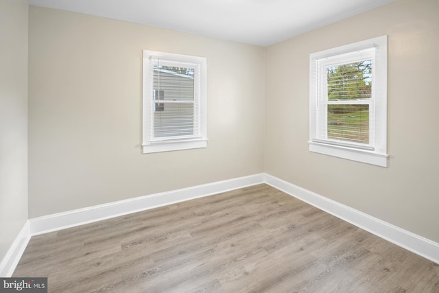 unfurnished room featuring light wood-type flooring